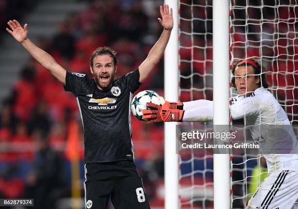 Juan Mata of Manchester United reacts as and appeals for a goal as Mile Svilar of Benfica attempts to stop the ball from crossing the line, a goal is...