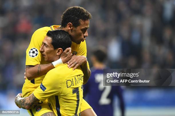 Paris Saint-Germain's Argentinian forward Angel Di Maria celebrates after scoring a goal with Paris Saint-Germain's Brazilian forward Neymar during...