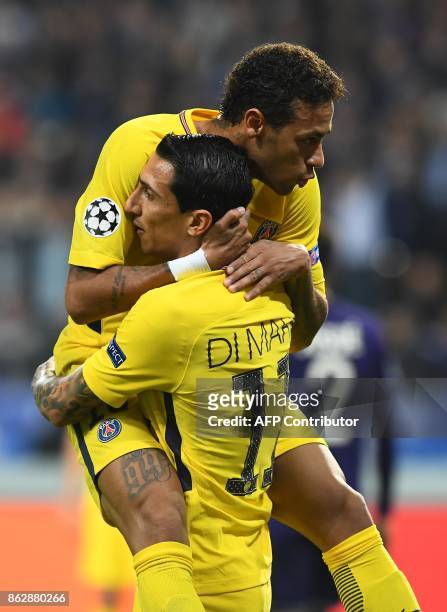 Paris Saint-Germain's Argentinian forward Angel Di Maria celebrates after scoring a goal with Paris Saint-Germain's Brazilian forward Neymar during...