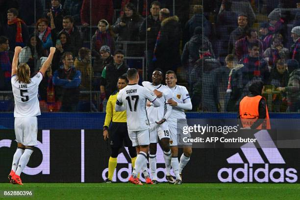 Basel's forward from Switzerland Dimitri Oberlin celebrates with teammates after scoring the team's second goal during the UEFA Champions League...