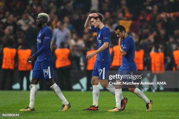 Tiemoué Bakayoko of Chelsea, Andreas Christensen of Chelsea and Pedro of Chelsea walk off the pitch dejected at full time during the UEFA Champions...
