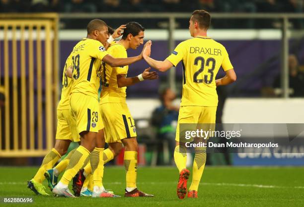 Angel Di Maria of PSG celebrates scoring his sides fourth goal with his PSG team mates during the UEFA Champions League group B match between RSC...
