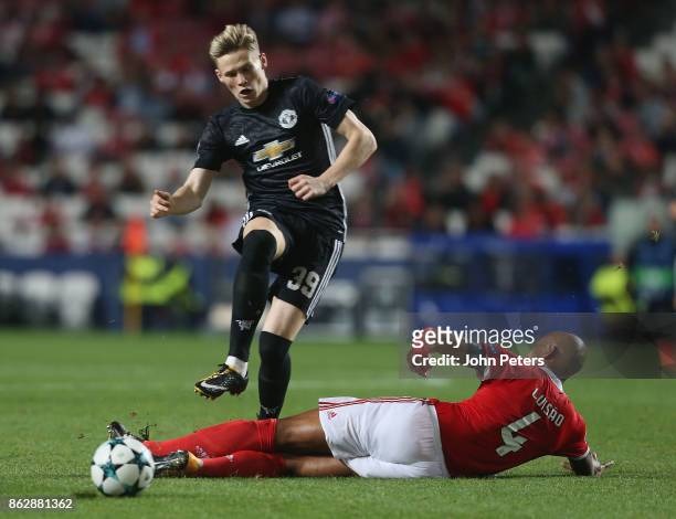 Scott McTominay of Mancester United is tackled by Luisao of Benfica, who is sent off for the challenge, during the UEFA Champions League group A...