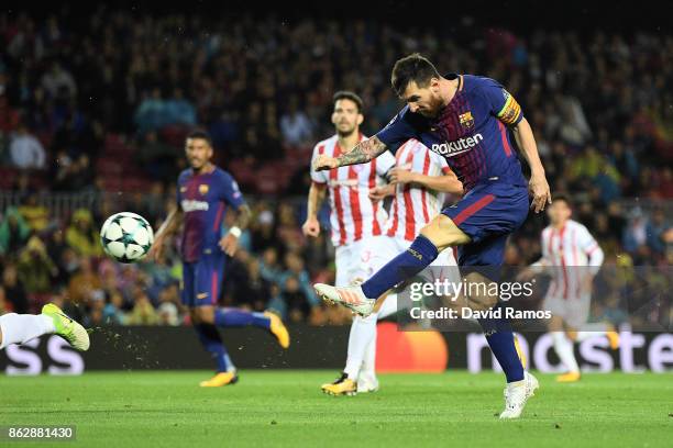 Lionel Messi of Barcelona shoots during the UEFA Champions League group D match between FC Barcelona and Olympiakos Piraeus at Camp Nou on October...