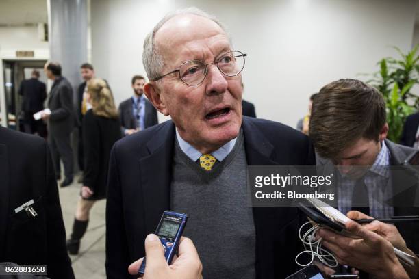 Senator Lamar Alexander, a Republican from Tennessee, speaks to members of the media while heading to a roll call vote on Capitol Hill in Washington,...