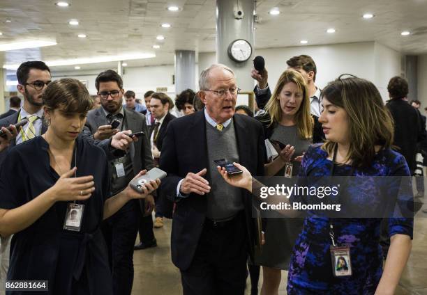 Senator Lamar Alexander, a Republican from Tennessee, speaks to members of the media while heading to a roll call vote on Capitol Hill in Washington,...