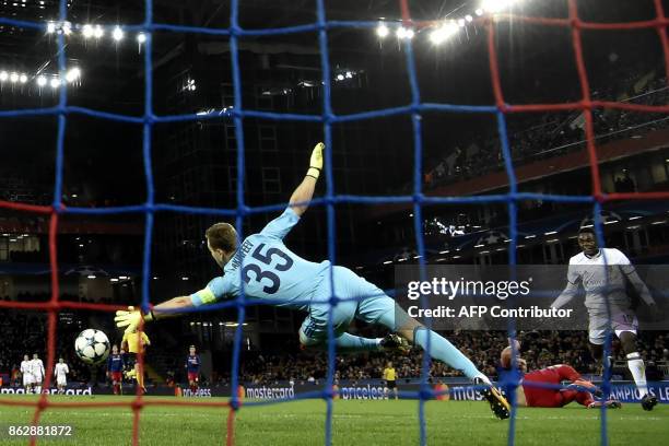 Basel's forward from Switzerland Dimitri Oberlin scores past CSKA Moscow's goalkeeper from Russia Igor Akinfeev during the UEFA Champions League...