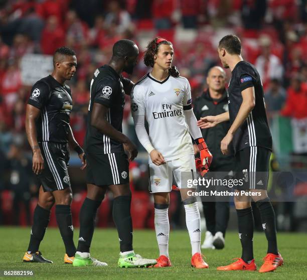 Romelu Lukaku and Nemanja Matic of Manchester United console Mile Svilar of Benfica after the UEFA Champions League group A match between SL Benfica...