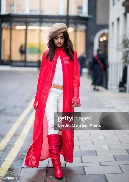 Camila Cabello wearing red kimono Ulyana Sergeenko, white pants, brown beret, red Stuart Weitzman boots is seen on October 18, 2017 in London,...