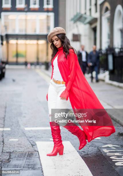 Camila Cabello wearing red kimono Ulyana Sergeenko, white pants, brown beret, red Stuart Weitzman boots is seen on October 18, 2017 in London,...