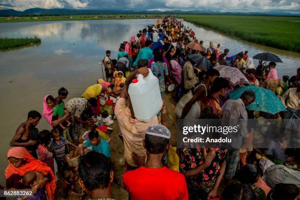 Large group of Rohingya people, fled from ongoing military operations in Myanmars Rakhine state, try to cross the border in Palongkhalii of Cox's...