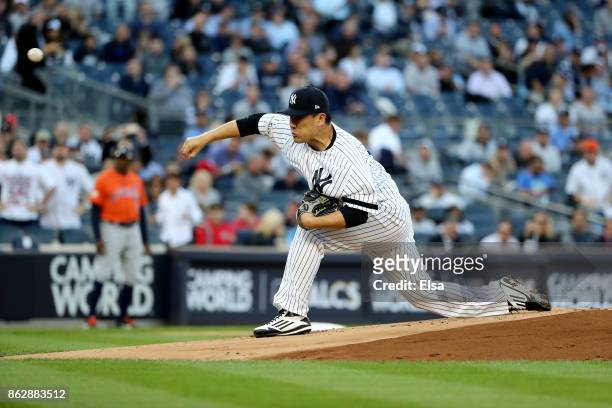 Masahiro Tanaka of the New York Yankees throws a pitch against the Houston Astros during the first inning in Game Five of the American League...