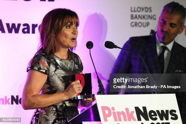 Maajid Nawaz and Lorraine Kelly receive a Pink News Broadcast Award during the the PinkNews awards dinner at One Great George Street in London.