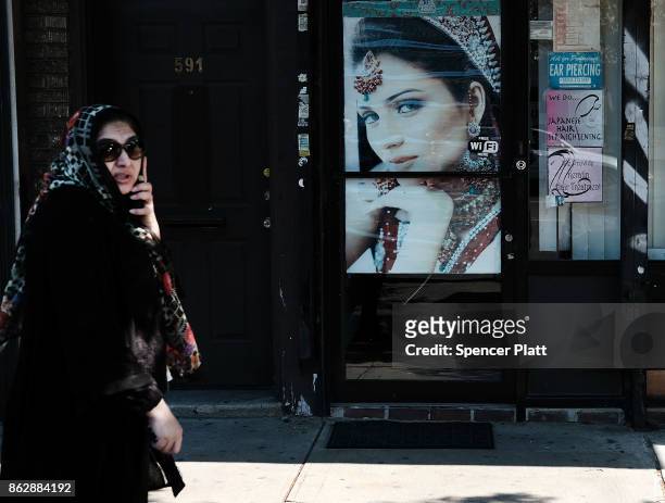 Picture advertises a beauty salon along Coney Island Avenue on October 18, 2017 in New York City. Coney Island Avenue, a road that runs north-south...