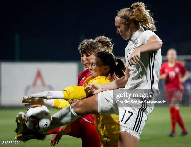 Annalena Rieke of Germany try to score near goalkeeper Sara Cetinja and Miljana Smiljkovic of Serbia during the international friendly match between...