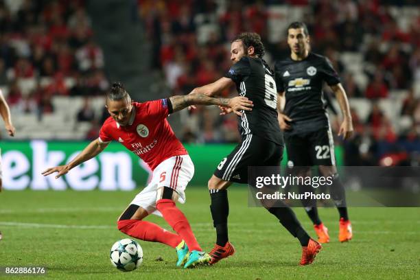 Benfica's Serbian midfielder Ljubomir Fejsa fights for the ball with Manchester United's Spanish midfielder Juan Mata during the UEFA Champions...