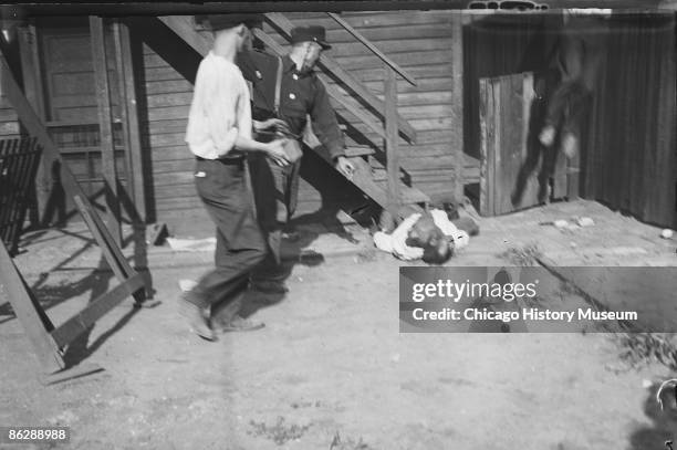 Whites stone an African American man, who later died of his injuries, during the Chicago race riots, 1919.