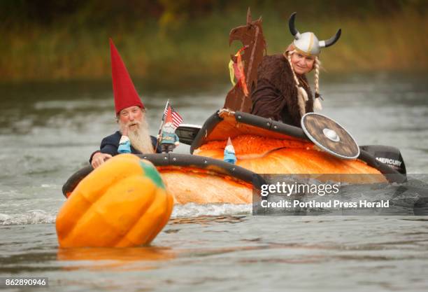 Tom Lishness of Windsor, aka The Gnome and Russell Orms of Austin, Texas, costumed as a viking, compete in the powerboat division race of the Pumpkin...