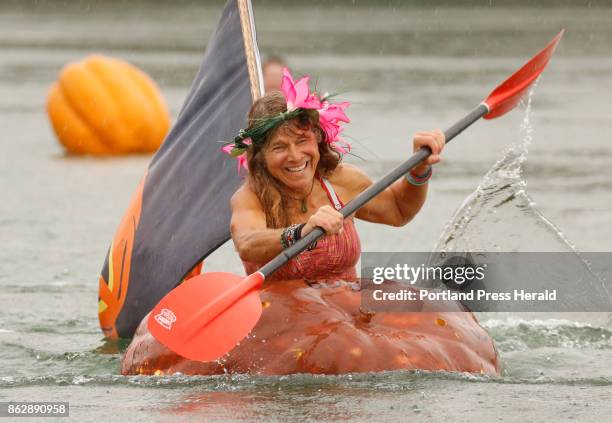 Jaja Martin of Bremen joyfully paddles during the Pumpkin Regatta, part of the Pumpkinfest in Damariscotta on Monday, October 9, 2017. In addition to...