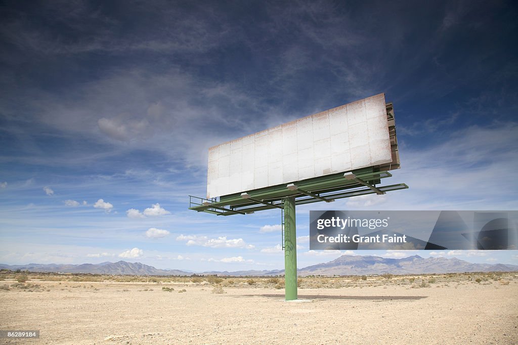 Blank billboard in desert