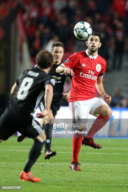 Benfica's Portuguese midfielder Pizzi vies with Manchester United's Spanish midfielder Juan Mata during the UEFA Champions League football match SL...