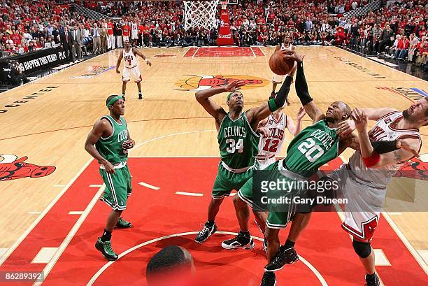 Ray Allen of the Boston Celtics rebounds the ball against Brad Miller of the Chicago Bulls in Game Four of the Eastern Conference Quarterfinals...