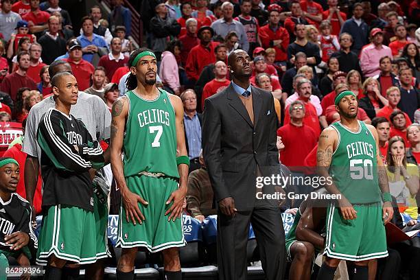 Bill Walker, Gabe Pruitt, Mikki Moore, Kevin Garnett, and Eddie House of the Boston Celtics watch from the sidelines in Game Four of the Eastern...