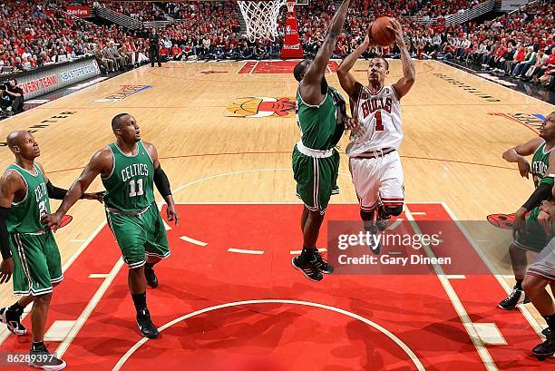 Derrick Rose of the Chicago Bulls puts up a shot against Kendrick Perkins of the Boston Celtics in Game Four of the Eastern Conference Quarterfinals...