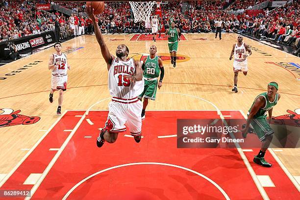 John Salmons of the Chicago Bulls lays up a shot past Ray Allen of the Boston Celtics in Game Four of the Eastern Conference Quarterfinals during the...