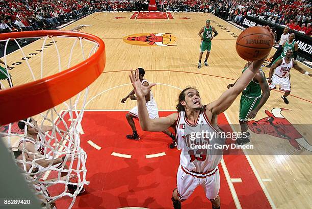 Joakim Noah of the Chicago Bulls rebounds the ball in Game Four of the Eastern Conference Quarterfinals against the Boston Celtics during the 2009...
