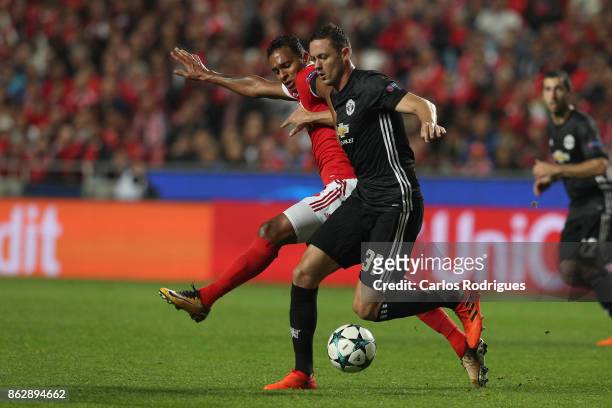Benfica's midfielder Filipe Augusto from Brasil vies with Manchester United midfielder Nemanja Matic from Serbia for the ball possession during SL...