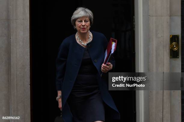 Britain's Prime Minister Theresa May leaves for the weekly Prime Minister Question session in the House of Commons, from Downing Street in central...