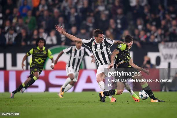 Mario Mandzukic of Juventus competes for the ball during the UEFA Champions League group D match between Juventus and Sporting CP at Allianz Stadium...