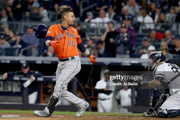 Yuli Gurriel of the Houston Astros reacts after striking out during the fourth inning against the New York Yankees in Game Five of the American...