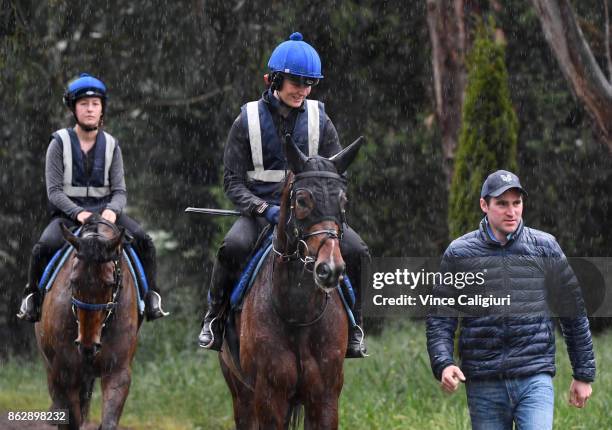 Annie Alexander riding Lord Fandango and Archie Alexander walk back to stables after a trackwork session at Ballarat Turf Club on October 19, 2017 in...