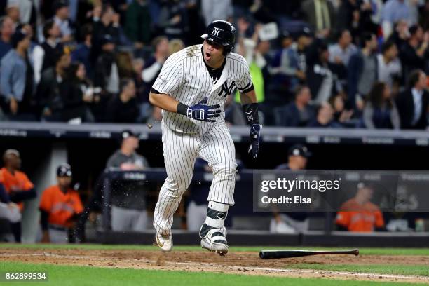 Gary Sanchez of the New York Yankees reacts as he hits a single during the fifth inning scoring Chase Headley against the Houston Astros in Game Five...