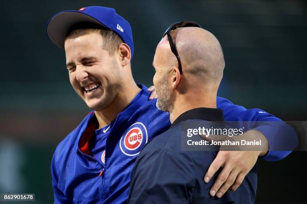 Anthony Rizzo of the Chicago Cubs and former Chicago Cubs player David Ross meet before game four of the National League Championship Series against...