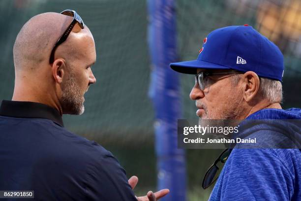 Former Chicago Cubs player David Ross meets with manager Joe Maddon of the Chicago Cubs before game four of the National League Championship Series...