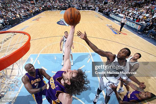 Pau Gasol of the Los Angeles Lakers reaches for a rebound over Paul Millsap of the Utah Jazz in Game Four of the Western Conference Quarterfinals...