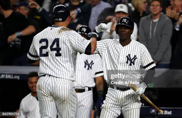 Gary Sanchez of the New York Yankees celebrates with Didi Gregorius after a solo home run during the seventh inning against the Houston Astros in...