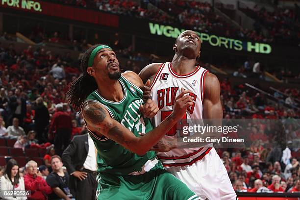 Mikki Moore of the Boston Celtics prepares to rebound against Linton Johnson III of the Chicago Bulls in Game Three of the Eastern Conference...