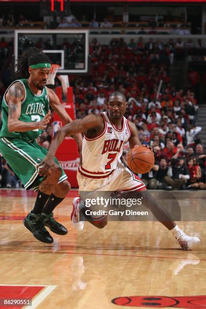 Ben Gordon of the Chicago Bulls moves the ball against Mikki Moore of the Boston Celtics in Game Three of the Eastern Conference Quarterfinals during...