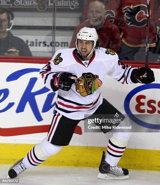 Adam Burish of the Chicago Blackhawks celebrates his goal against the Calgary Flames in Game Six of the Western Conference Quarterfinals of the 2009...