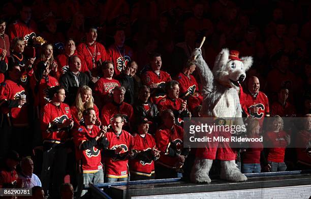 The Calgary Flames mascot "Harvey the Hound" leads fans in a cheer before the Flames played the Chicago Blackhawks in Game Six of the Western...