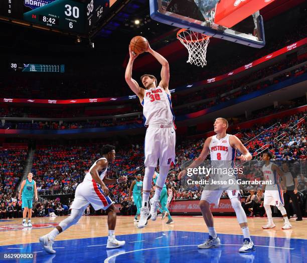 Jon Leuer of the Detroit Pistons grabs the rebound against the Charlotte Hornets during the game on October 18, 2017 at Little Caesars Arena in...