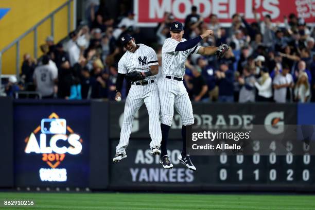 Aaron Hicks and Aaron Judge of the New York Yankees celebrate after defeating the Houston Astros in Game Five of the American League Championship...