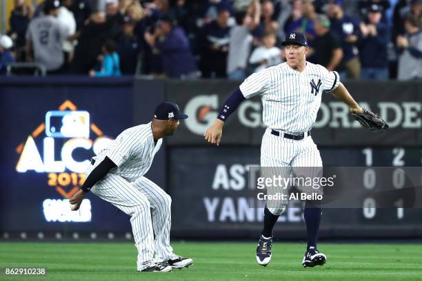 Aaron Hicks and Aaron Judge of the New York Yankees celebrate after defeating the Houston Astros in Game Five of the American League Championship...