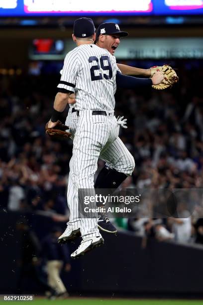 Todd Frazier and Greg Bird of the New York Yankees celebrate after defeating the Houston Astros in Game Five of the American League Championship...