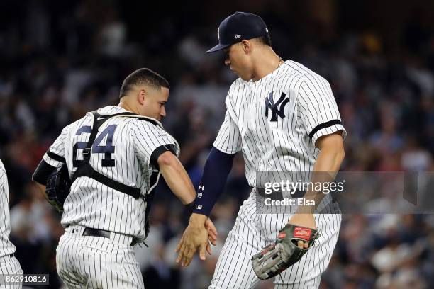 Gary Sanchez and Aaron Judge of the New York Yankees celebrate after defeating the Houston Astros in Game Five of the American League Championship...