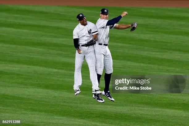 Aaron Hicks and Aaron Judge of the New York Yankees celebrate after defeating the Houston Astros in Game Five of the American League Championship...